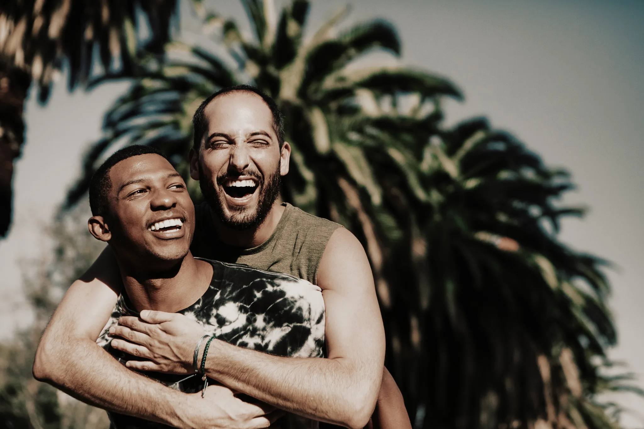 Gay couple hugging in the park