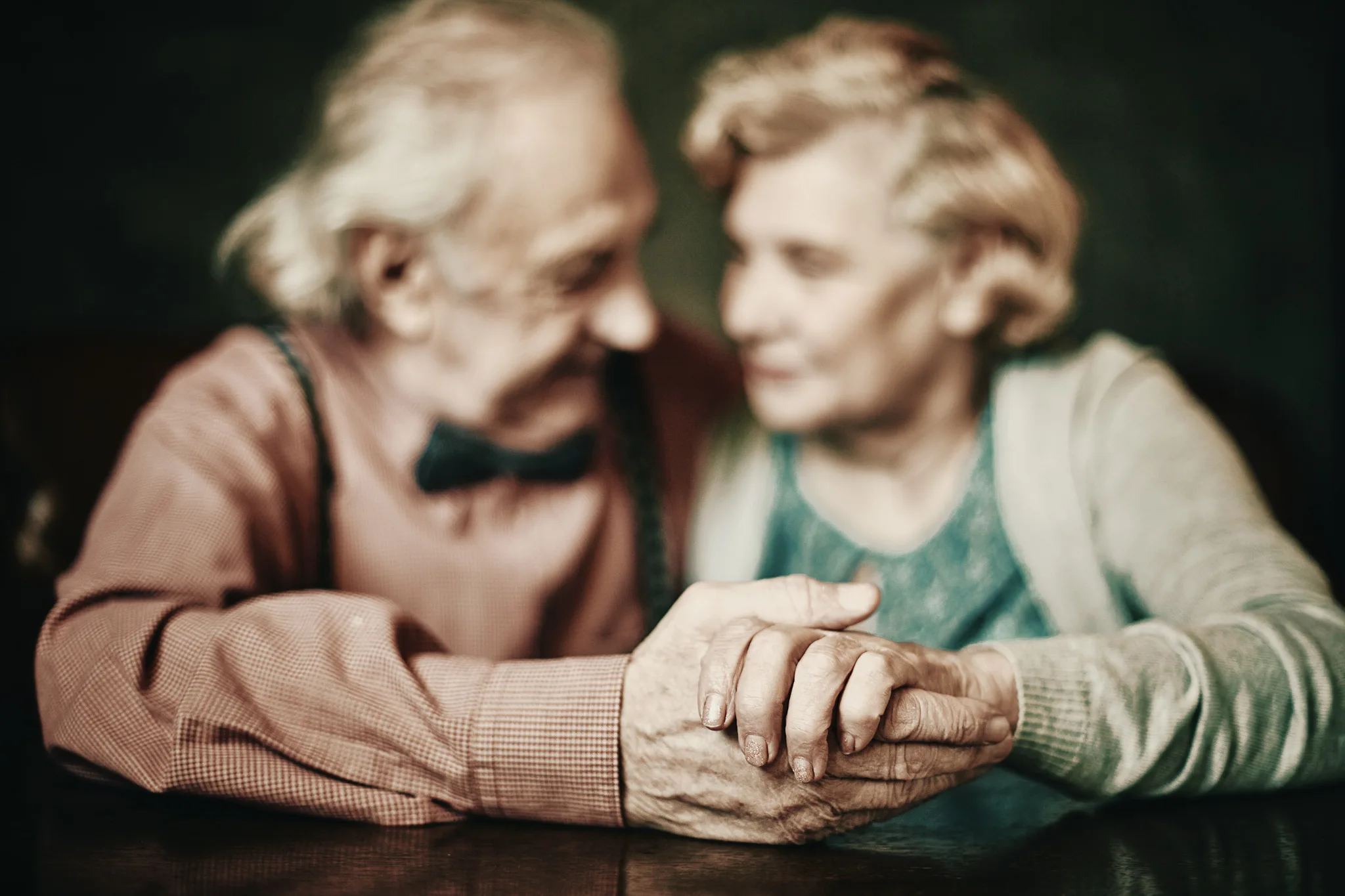 Senior couple holding hands